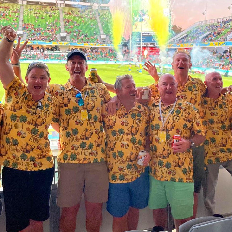 Rhinos RFC in matching yellow tour polos at the rugby sevens